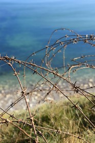 France, Calvados, Cricqueville en Bessin, Pointe du Hoc, barbed wire from a blockhouse