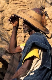 Mali, Dogon Country, Bandiagara Cliff listed as World Heritage by UNESCO, elder of a village wearing a traditional hat