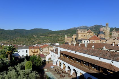 Spain, Extremadura, Guadalupe, Royal Monastery of Santa Maria de Guadalupe listed as World Heritage by UNESCO and the Parador of Tourism former Saint John the Baptist Hospital (San Juan Bautista hospital) in the foreground