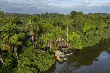 France, French Guiana, Kourou, the carbet (shelter) at Camp Maripas on the banks of the Kourou river (aerial view)