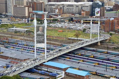 South Africa, Gauteng Province, Johannesburg, Nelson Mandela bridge over train carriages at Park Station and Johannesburg CBD (Central Business District)