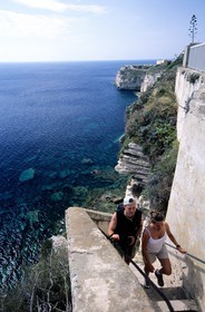 France, Corse du Sud, Bonifacio, tourists climbing the stairs of the king of Aragon (escalier du roi d'Aragon)