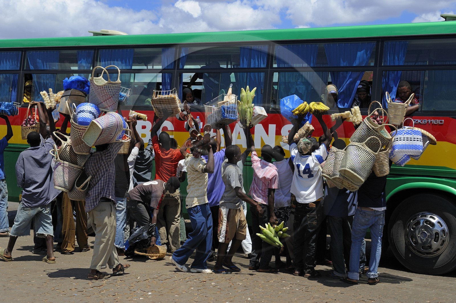Tanzania, Morogoro, the bus terminal, small vendors assaults at a bus stop Tanzania, Morogoro, the bus terminal, small vendors assaults at a bus stop