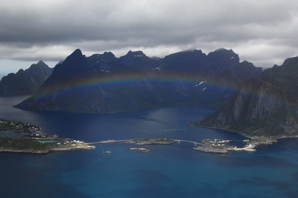 Norway, Nordland County, Lofoten Islands, Moskenes island , fishermen's village of Hamnoy near Reine, rainbow (aerial view)