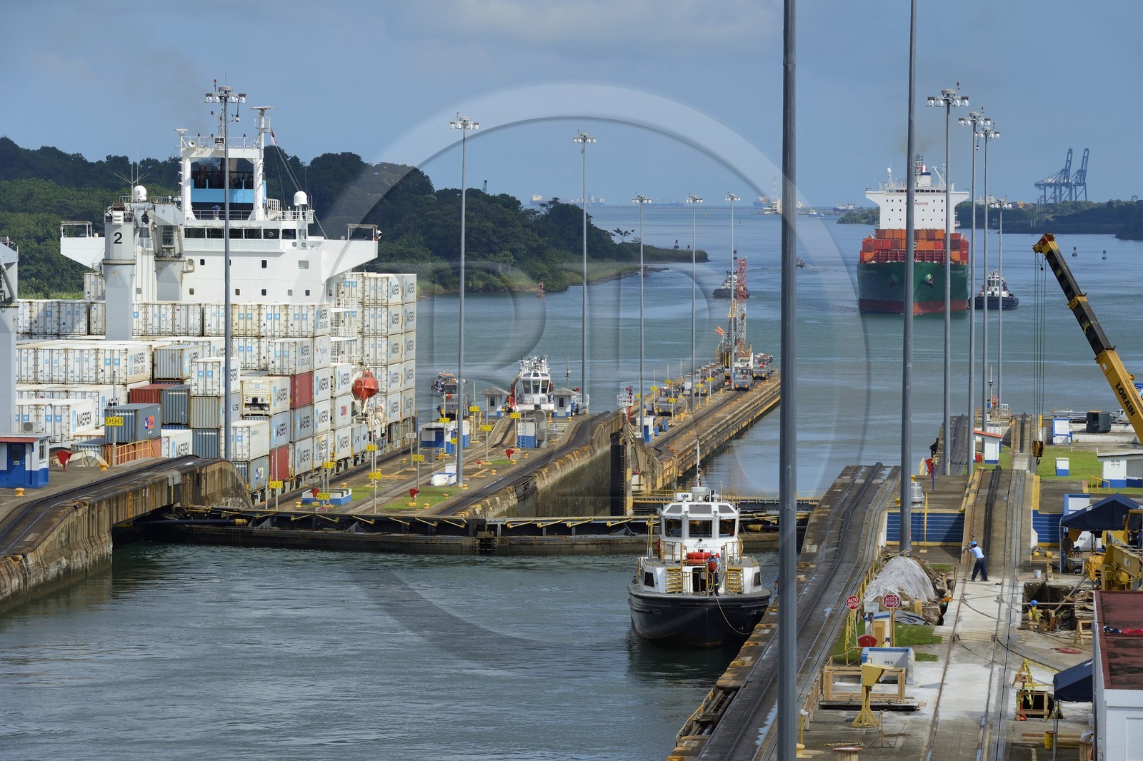 Panama, Colon province, Panama Canal, Gatun locks, Panamax container ship passing the lock, tugboat