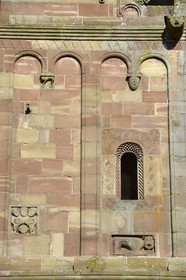 France, Bas Rhin, Marmoutier, Roman abbey church dated 6th century, western Facade in red sandstone from Vosges Mountains, the decoration of the facade has carved elements of heads, body and geometric elements
