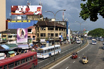 Sri Lanka, Western Province, Colombo District, Colombo, three wheelers and buses on W E Bastian Mawatha street bordering the district of Pettah