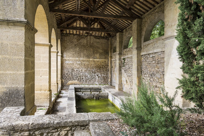 France, Gard, old washhouse on the route de Misserand in the village which is on the path along the route of the Roman aqueduct of Nimes