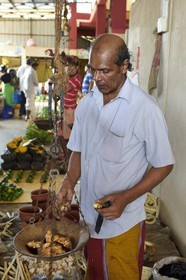 Sri Lanka, Eastern Province, Trincomalee, the covered market, selling ginger