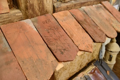 France, Haut Rhin, Sundgau, Oltingue, the Peasant Museum, last tile placed on a roof, the tile is blessed for good luck