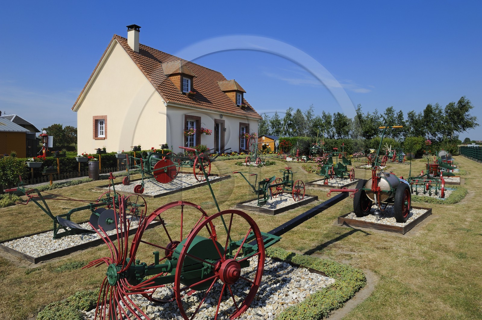 France, Eure, Saint Aubin sur Quillebeuf, collection of agricultural machinery in the garden of Mr. Tesson