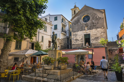 Italy, Liguria, Cinque Terre National Park listed as World Heritage by UNESCO, village of Corniglia, the oratory of the Disciplinati di Santa Caterina and the war memorial in the main square Largo Taragio