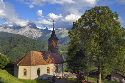 Switzerland, Canton of Vaud, Ollon, hamlet of Huemoz protestant temple and the massif of Argentine in the background