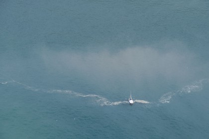 France, Seine-Maritime, sailboat off the coast of Le Havre (aerial view)