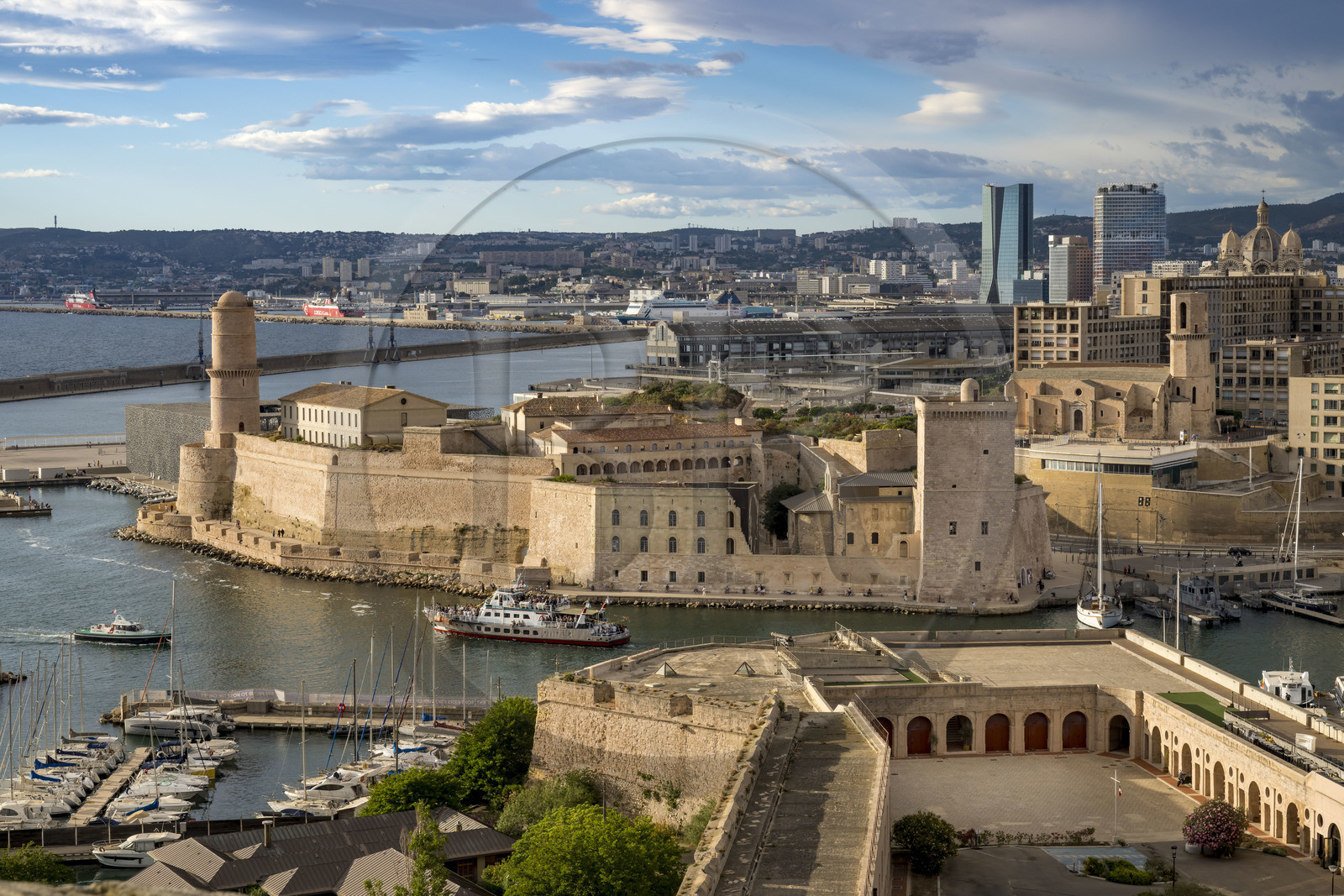 France, Bouches du Rhone, Marseille, the Fort Saint Jean at the Vieux Port entrance seen from the Fort Saint Nicolas, Fort Ganteaume (lower Fort Saint Nicolas) in the foreground and the CMA CGM tower and La Marseillaise tower in the background