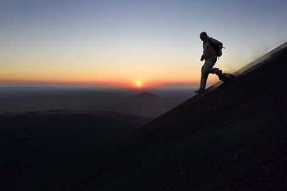 Nicaragua, Leon area, Volcan Cerro Negro in the Cordillera Maribios (or Marrabios), man running down volcano