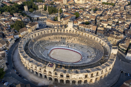 France, Bouches du Rhone, Arles, the Arena, a Roman amphitheater built around 80-90 AD and the theatre from the 1st century BC in the background on the left, listed as World heritage by UNESCO, in the heart of the old town (aerial view)