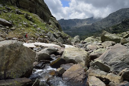France, Alpes-Maritimes, parc national du Mercantour (Mercantour National Park), the Vallee des Merveilles (Valley of Wonders) scattered with thousands of rupestral engravings of the Bronze Age, hiker on the trail GR 52