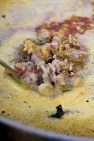 France, Pyrenees Atlantiques, Basque Country, Espelette, cooking an Axoa that is a typical Basque dish prepared with mashed veal, onions, tomatoes sauté and flavoured with red Espelette pepper