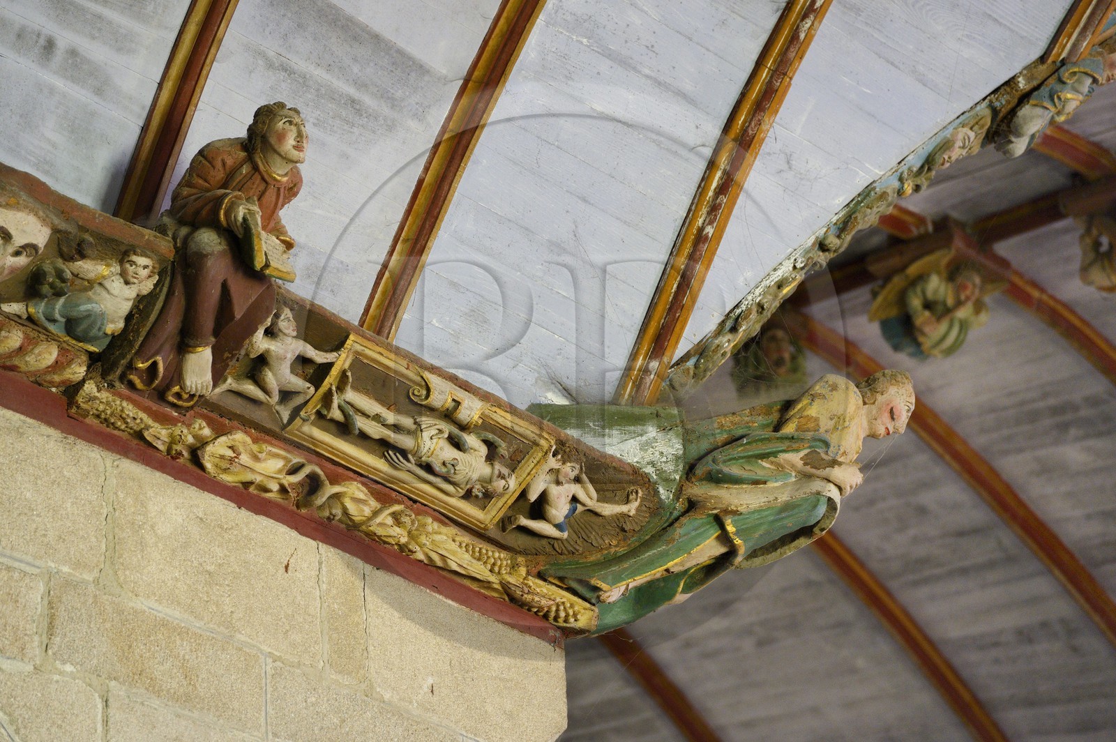 France, Finistere, Pleyben church, wooden painted sculptures on the stringer decorating the vault