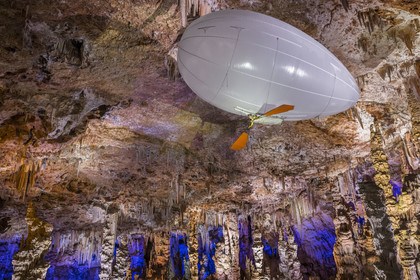 France, Gard, Mejannes-le-Clap, grotte de La Salamandre (Salamander cave), discovery of the cave in Aéroplume®, an individual dirigible balloon inflated with helium which allows you to fly away by flapping your wings