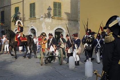 Italy, Liguria, Sarzana, Napoleon Festival, the french military commander Marshal of the Empire Massena on horseback is watching the preparations for a cannon fire during the fighting in the streets of the old town