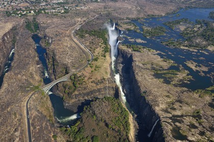 Zimbabwe, Matabeleland North Province,  Zambesi River, the Victoria Falls, listed as World Heritage by UNESCO, bridge that marks the border between Zimbabwe and Zambia (aerial view)