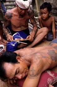 Malaysia, Borneo island, Sarawak, Dayak warrior (from the Iban) tribe traditional tattoo session