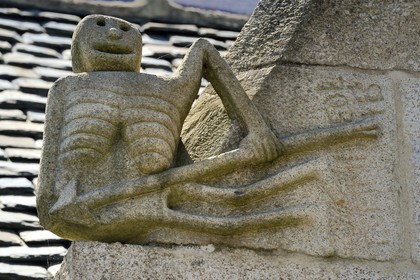 France, Finistere, Pleyben, statue of the Ankou (personification of death in Breton mythology) on the facade of a house
