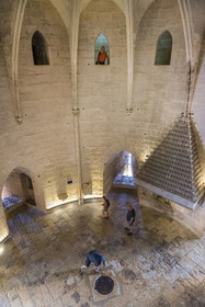 France, Gard, Aigues Mortes, the Tower of Constance, the guard room with its fireplace and the circular opening in the center which gives access to the basements which served as a pantry, ammunition reserve and also as dungeons, the so called culs-de-basse-fosse