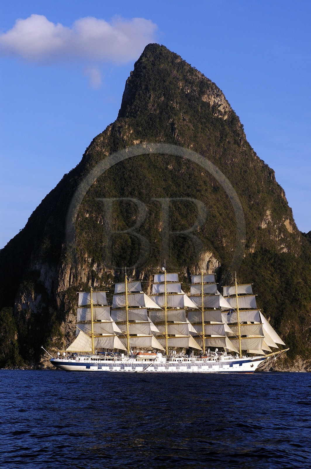 Caribbean sea, Saint Lucia island, the five masted ship SPV Royal Clipper with every sail set in front of the Piton of Soufriere