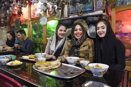 Iran, Isfahan Province, Isfahan, Chai Khaneh Azadegan Tea House and restaurant, young iranian women student in medical engineering whose name are, from left to right, Pita, Nadia and Niloufar (no model release)