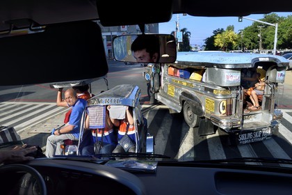 Philippines, Luzon island, Manila, Ermita district, jeepney (elongated jeep to transport passengers) and tricycle motorcycle taxi on Kalaw Avenue