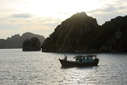 Vietnam, Quang Ninh Province, Halong Bay, listed as World Heritage by UNESCO, fishing boat