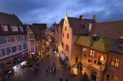 France, Haut Rhin, Colmar, gabled houses and wood-framed houses in Grand Rue with Christmas decorations, on the right the former douane or customs control edifice (Koifhus)
