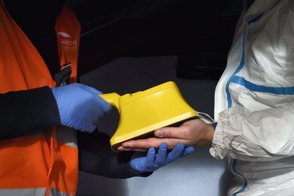 France, Bas-Rhin, Schiltigheim, intervention of two engineers from the National Agency for the Management of Radioactive Waste (Andra) in a private home to remove radioactivity from a rare model of a century-old radium fountain, the contamination meter measures the level of residual radioactive contamination, here on the hands