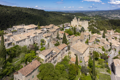 France, Vaucluse, Dentelles de Montmirail mountains, Crestet, the hilltop village of Crestet and its 9th century castle (aerial view)