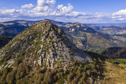 France, Ardeche, parc naturel regional des Monts d'Ardeche (Regional natural reserve of the Mounts of Ardeche), Mont Gerbier de Jonc (altitude of 1551m), source of the Loire river, the Suc de Sara mountain in the middle distance and the Roches de Borée mountain in the background (aerial view)