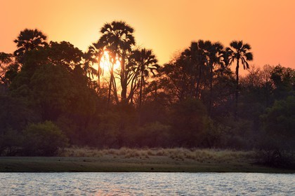 Zimbabwe, Matabeleland North Province, Victoria Falls, sunset on the Zambezi River upstream from Victoria Falls