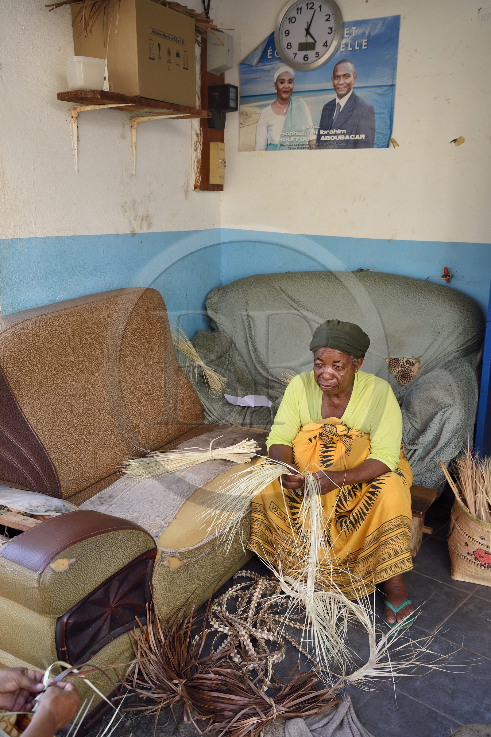 France, Mayotte island (French overseas department), Grande-Terre, Sada, Mahoran women weaving phoenix reclina wild (palm tree) fibers to make baskets
