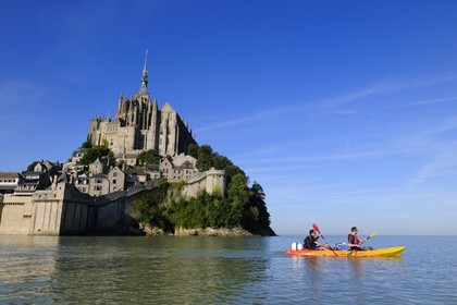France, Manche, Mont Saint Michel, East side at high tide, listed as World Heritage by UNESCO, crossing the Bay of Mont Saint Michel in kayak