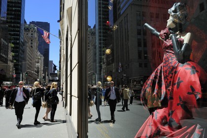 United States, New York, Manhattan, reflection of a skyscraper in a shop window dedicated to Alexander McQueen of the store Bergdorf Goodman on 5th Avenue