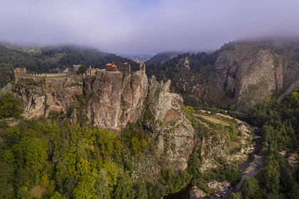 France, Haute Loire, Loire river Valley, Arlempdes, labelized the Most Beautiful Villages of France, ruins of the castle perched on a basalt rock (volcanic dyke) overlooking a Loire river meander (aerial view)