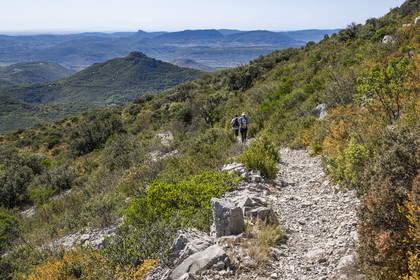 France, Herault, the Causses and the Cevennes, Mediterranean agro pastoral cultural landscape, listed as World Heritage by UNESCO, Saint Privat, hikers on the path from Mont Saint Baudille towards Saint-Guilhem-le-Désert
