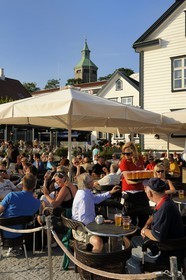 Norway, Rogaland County, Stavanger, cafe terrace in the old harbour (Vagen)