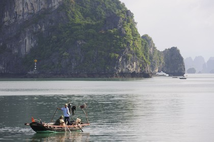 Vietnam, Quang Ninh Province, Halong Bay, listed as World Heritage by UNESCO, fishing boat