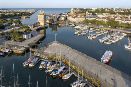 France, Charente Maritime, La Rochelle, the Old Port, Tour Saint Nicolas and Tour de la Chaine protect the entrance to the Old Port, the tour de la Lanterne in the background (aerial view)