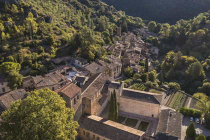 France, Herault, the Causses and the Cevennes, Mediterranean agro pastoral cultural landscape, listed as World Heritage by UNESCO, Saint Guilhem le Desert, labelled Les Plus Beaux Villages de France (The Most Beautiful Villages of France), the 9th century Gellone abbey (aerial view)