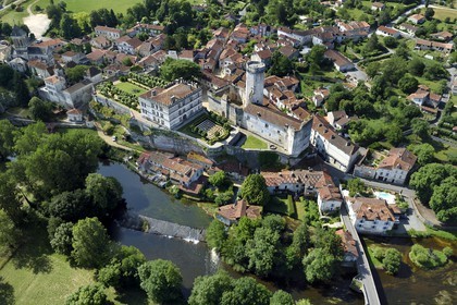 France, Dordogne, Perigord Vert, Bourdeilles, the castle overlooking the village and the Dronne river (aerial view)