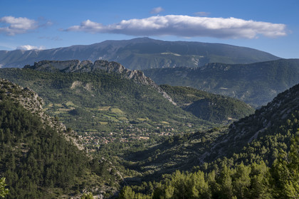 France, Drome, regional natural park of Baronnies provencales, the large limestone blade of the Rocher de Saint-Julien over looking Buis les Baronnies, Mont Ventoux in the background (aerial view)